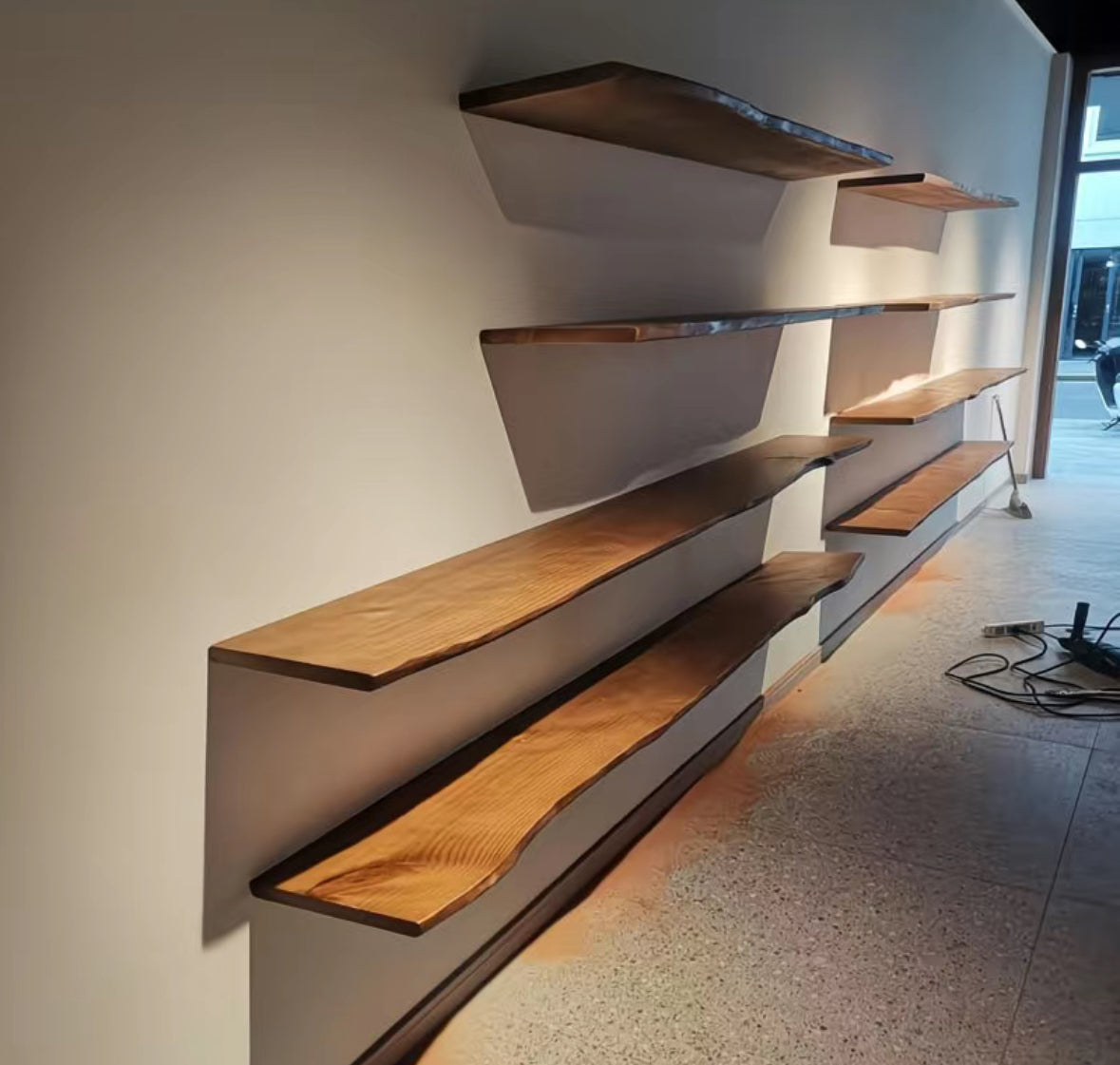 Brown rustic hardwood wall shelf with an irregular live edge
