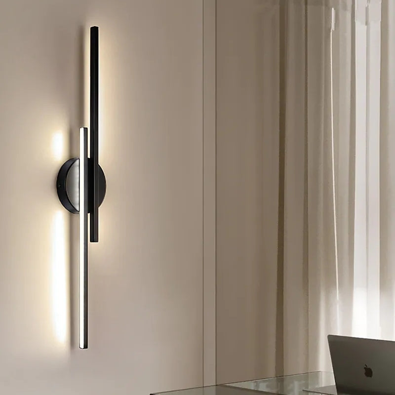 Slim vertical adjustable wall sconce with circular backplate