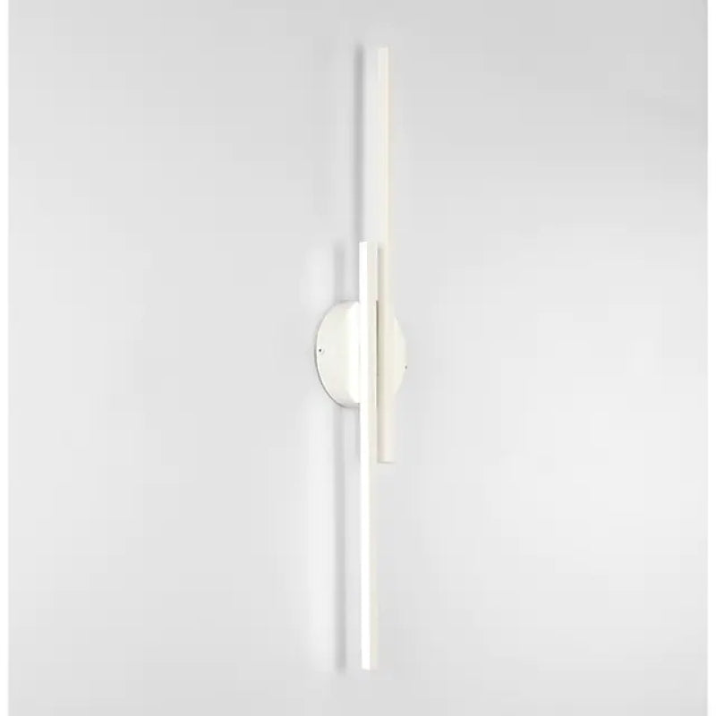 Slim vertical adjustable wall sconce with circular backplate