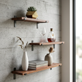 Brown wall shelf with dark metal lip brackets displaying books and ornaments