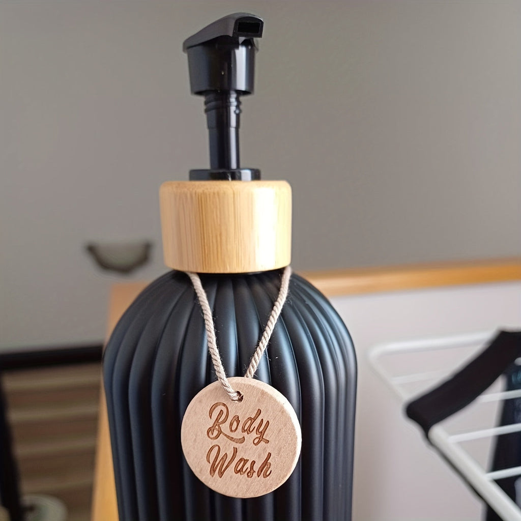 Three refillable bathroom pump bottles with labelled hanging tags