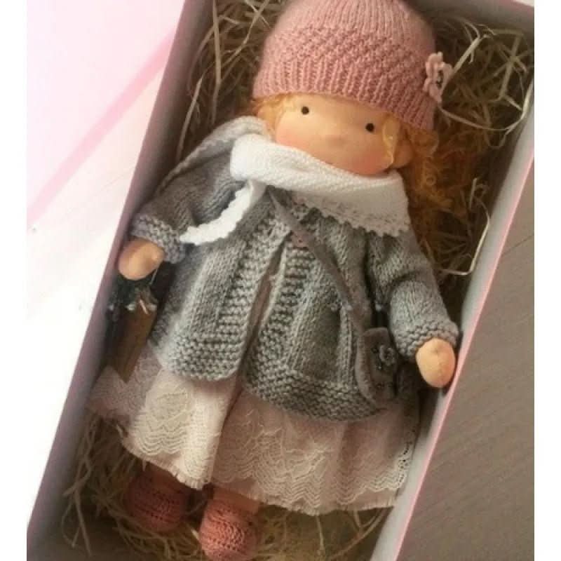 Handmade Waldorf-style doll with knitted rabbit companion and clothing