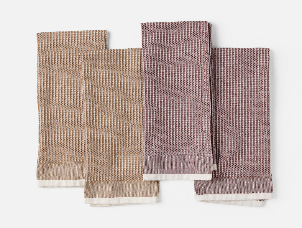 Set of four waffle-textured kitchen towels with contrast trims
