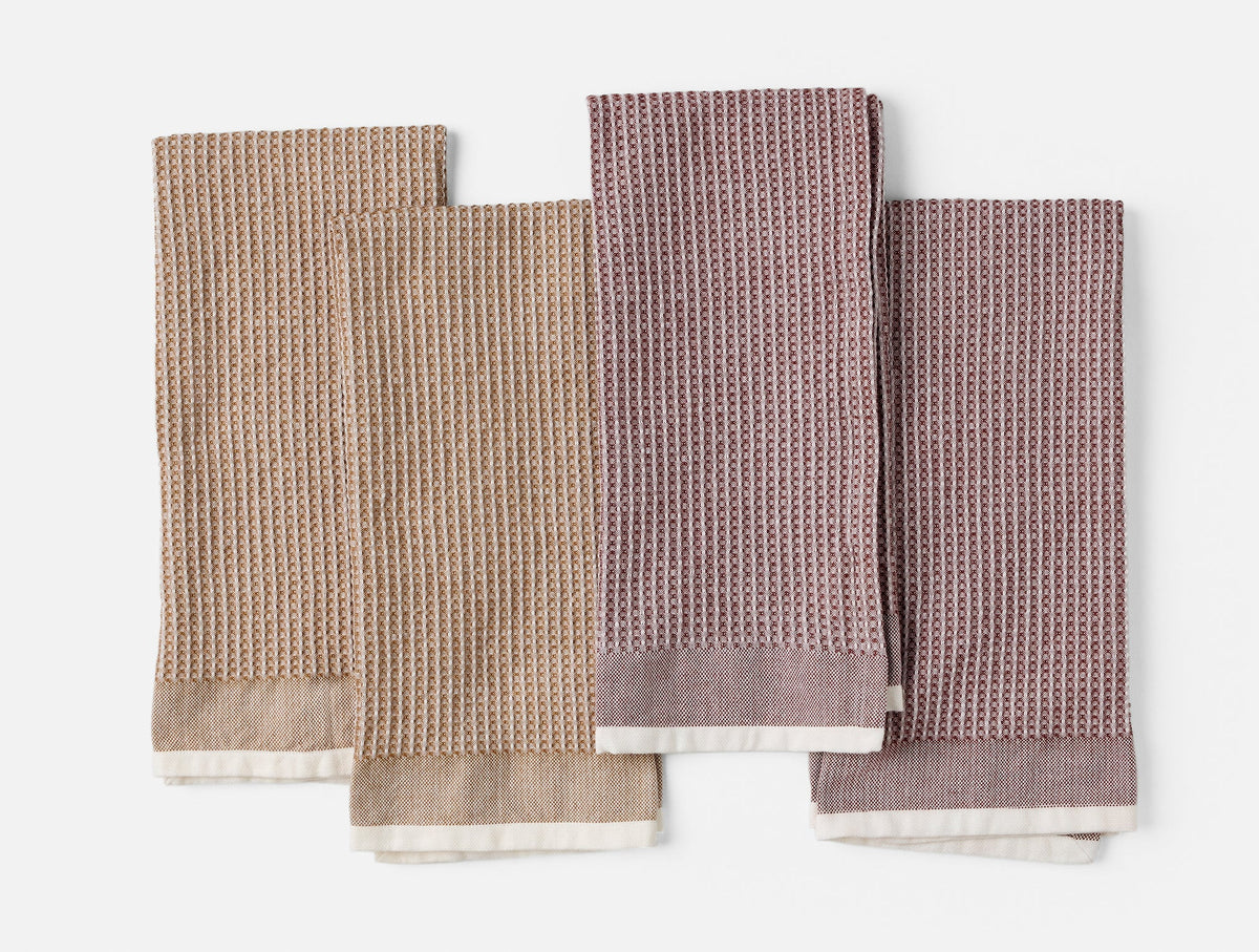Set of four waffle-textured kitchen towels with contrast trims