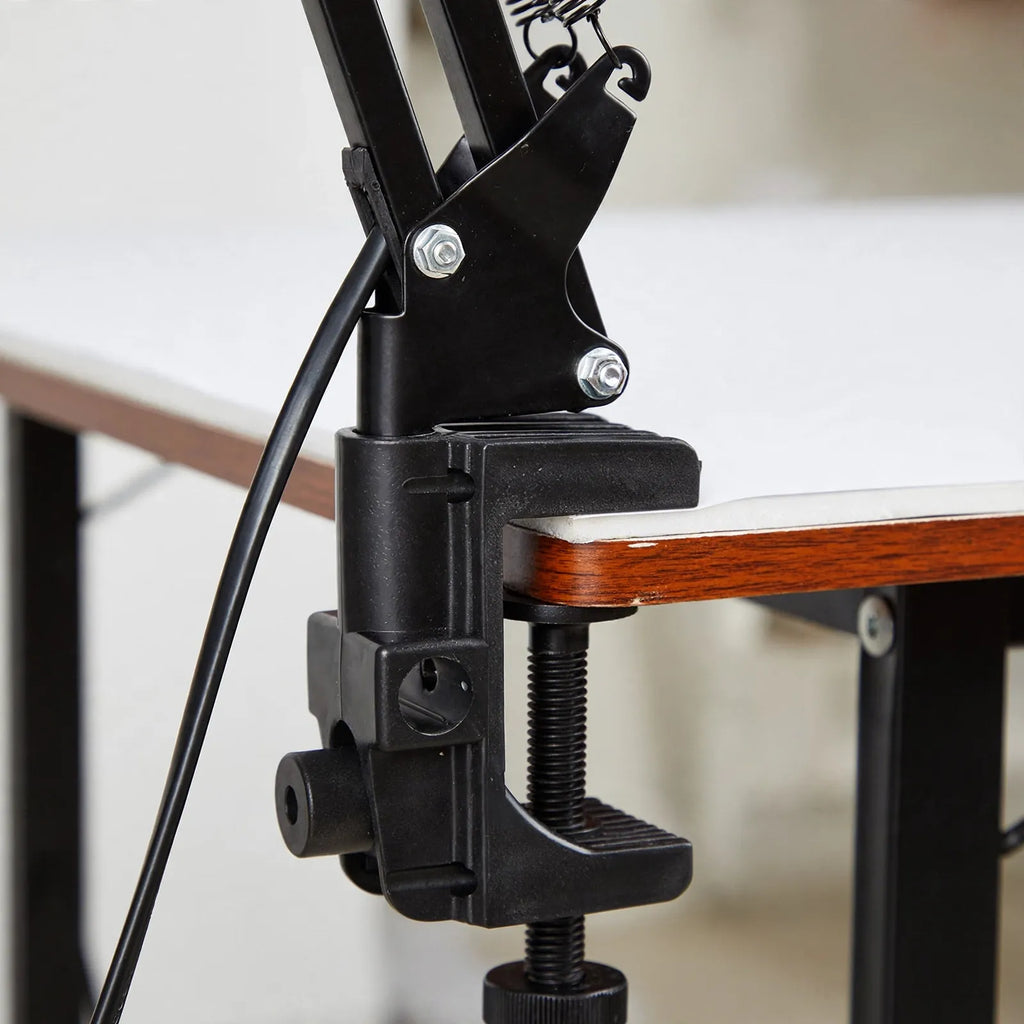 Fintok - Adjustable Clamp Desk Lamp With Articulated Arm Illuminating A Dedicated Workspace Without Cluttering Table Space
