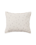 Beige muslin pillowcase with small purple floral pattern and gathered texture