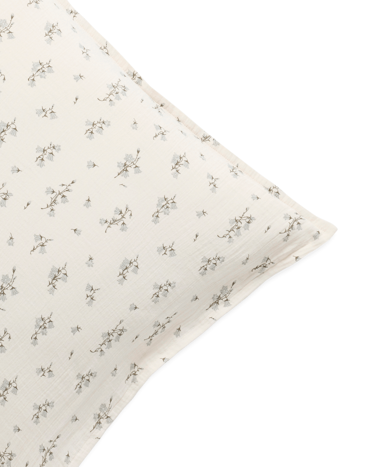 Cream muslin pillowcase with a delicate botanical floral pattern