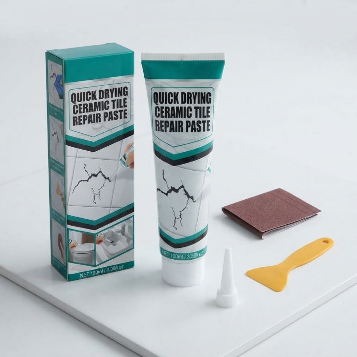 White ceramic tile repair paste tube with yellow spatula, nozzle and sanding sheets