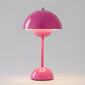Dimmable modern table lamp with a rounded dome shade and slim stem