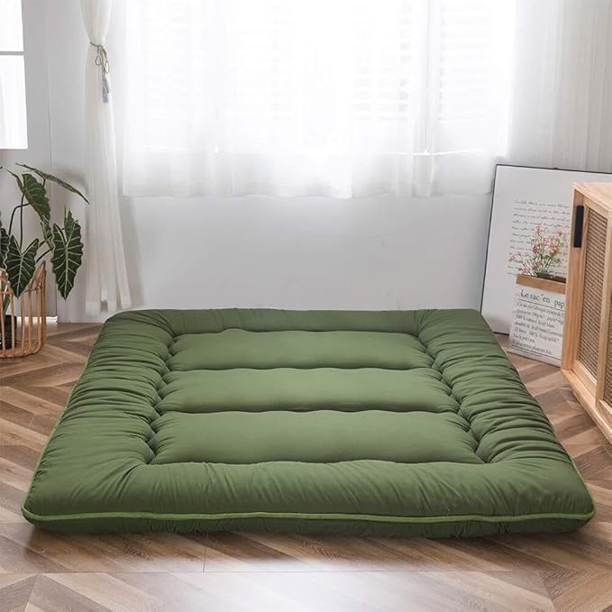 Foldable padded Japanese floor mattress with a raised border