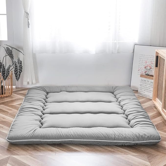 Foldable padded Japanese floor mattress with a raised border