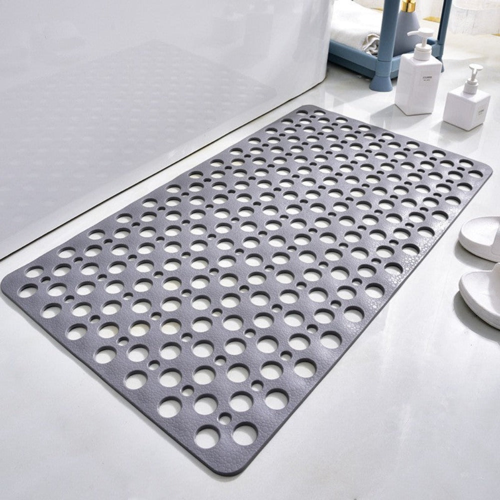 Perforated non-slip bath mat with repeated circular holes