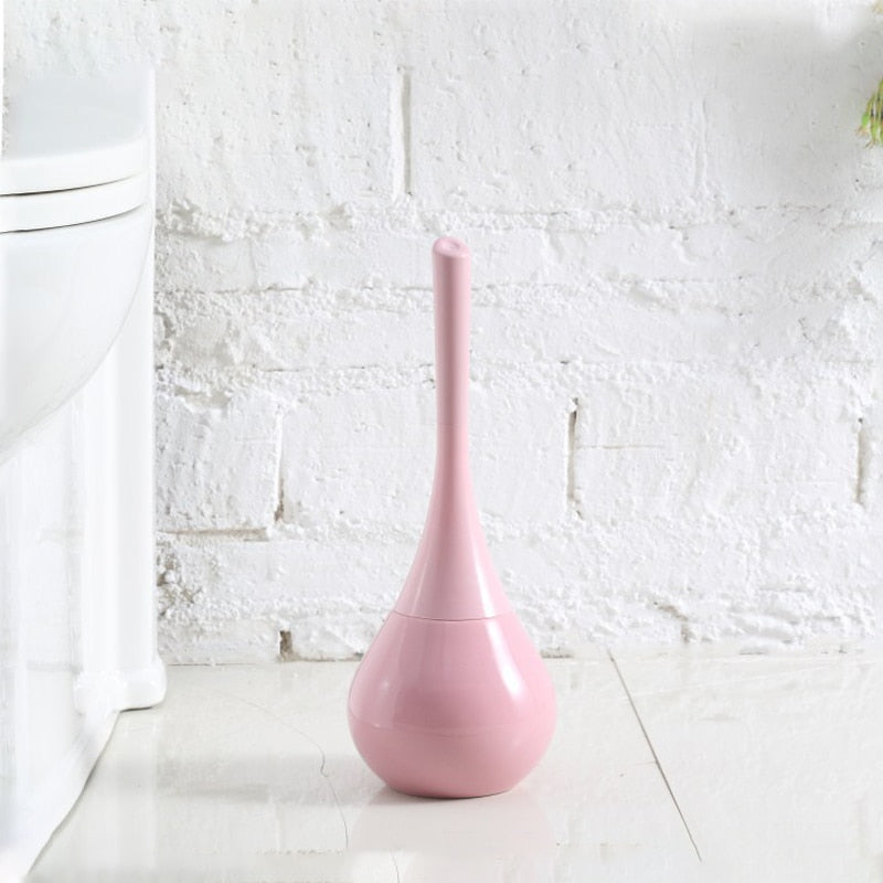 Freestanding toilet brush and rounded holder in metallic finish