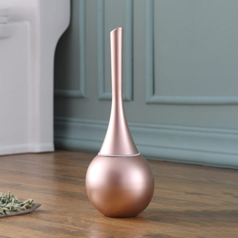 Freestanding toilet brush and rounded holder in metallic finish