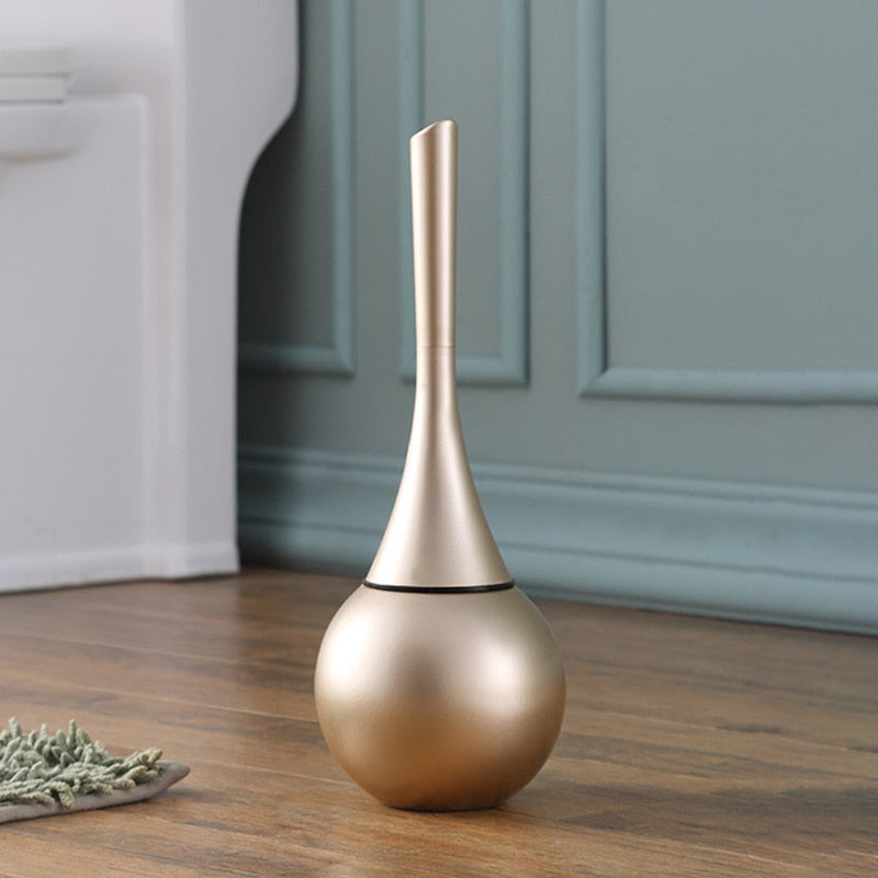 Freestanding toilet brush and rounded holder in metallic finish