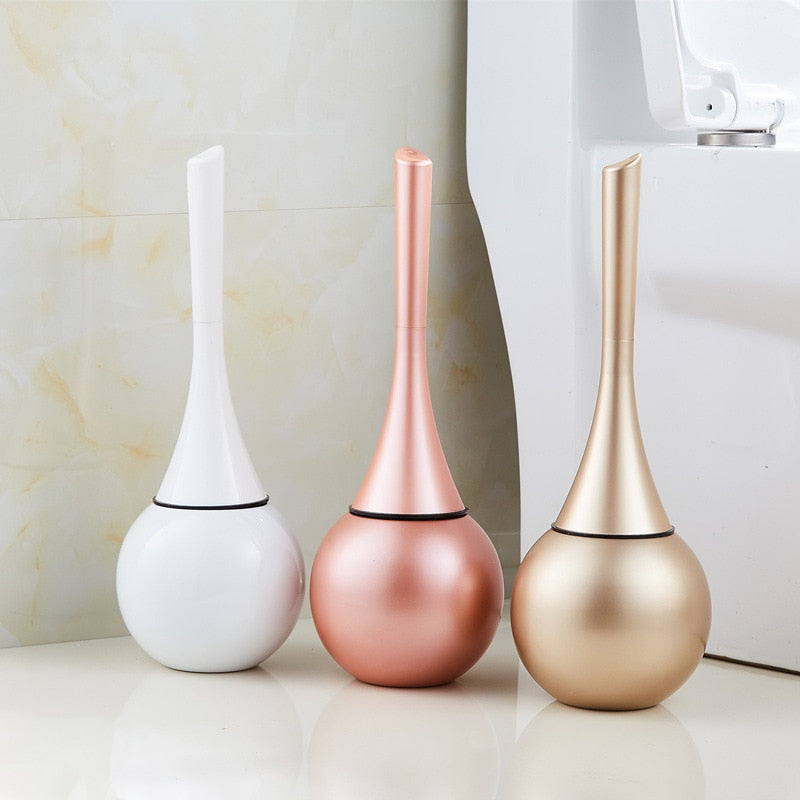 Freestanding toilet brush and rounded holder in metallic finish