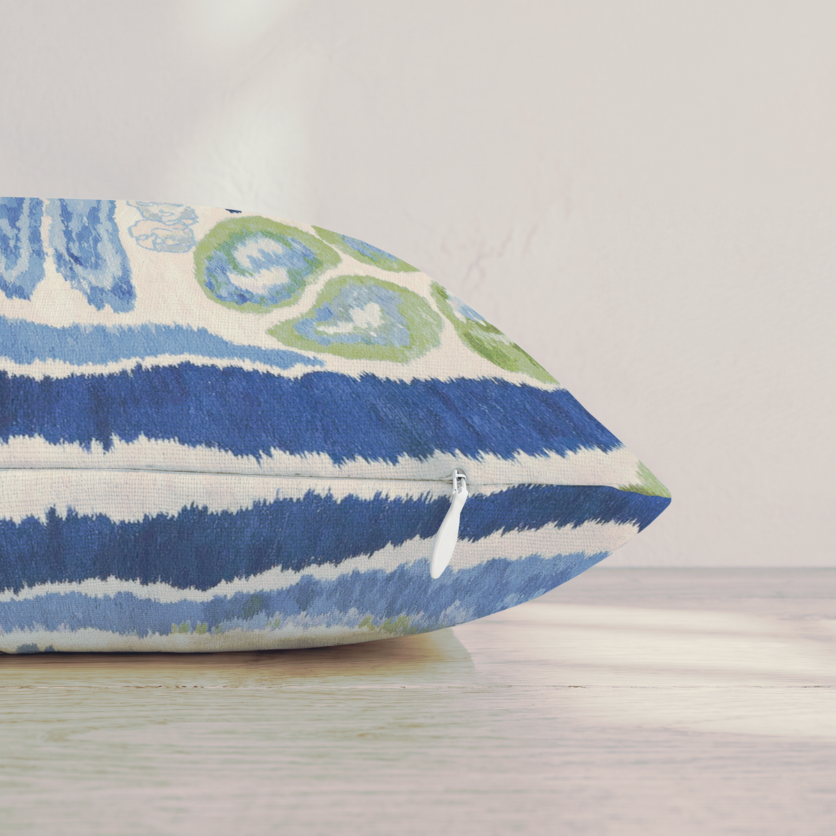 Blue and green abstract square throw pillow with piped edge
