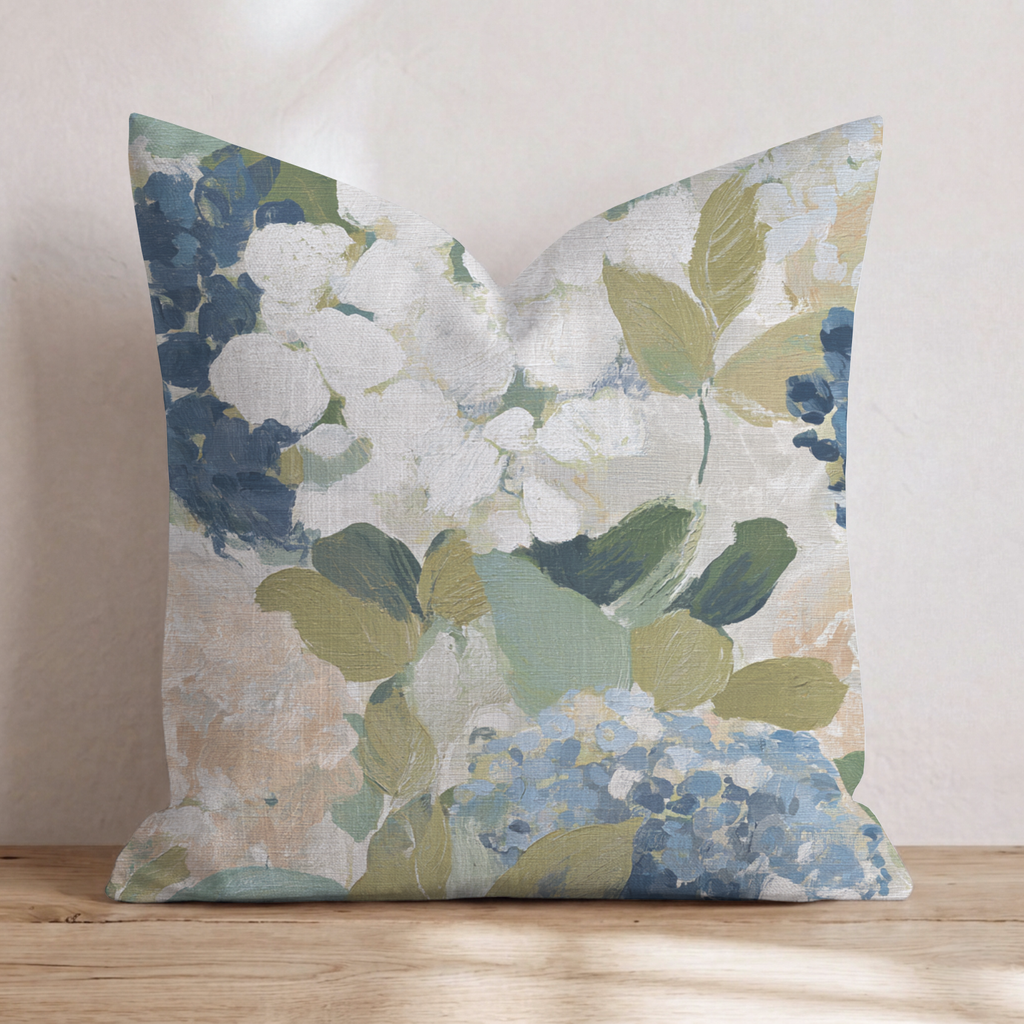 Blue floral throw pillow with botanical flowers and leaves