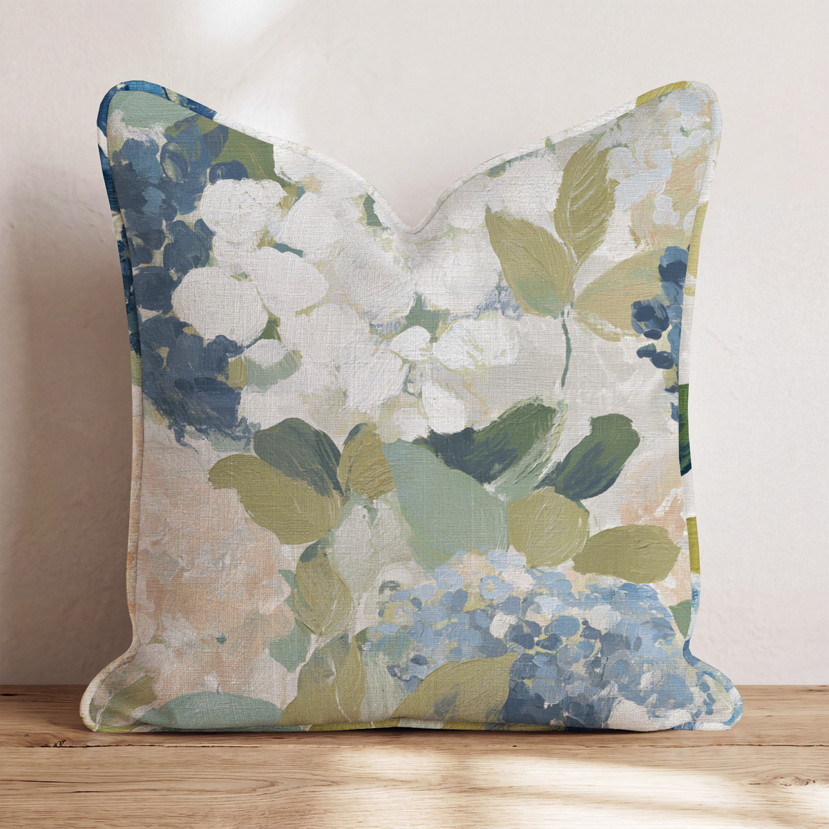 Blue floral throw pillow with botanical flowers and leaves