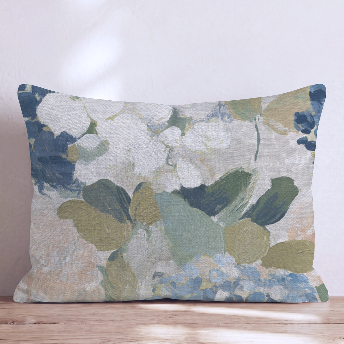 Blue floral throw pillow with botanical flowers and leaves