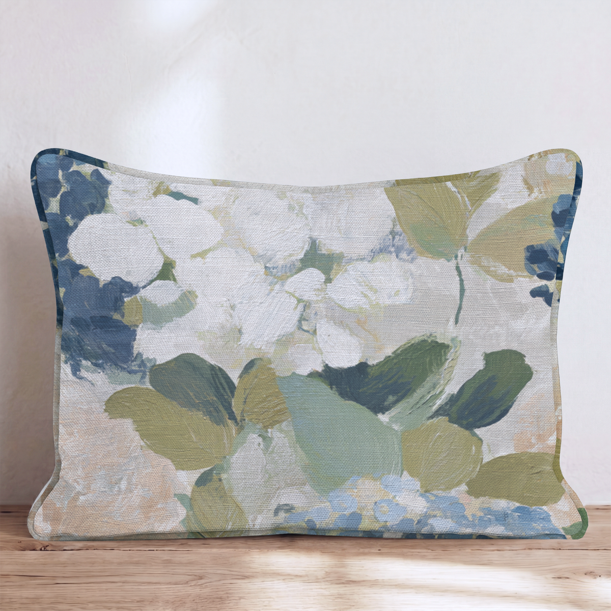 Blue floral throw pillow with botanical flowers and leaves