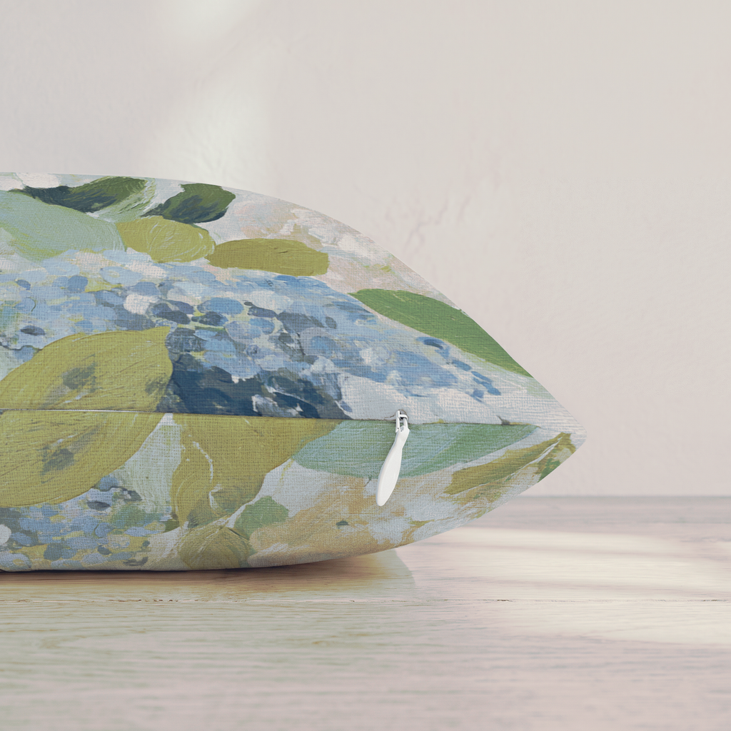 Blue floral throw pillow with botanical flowers and leaves