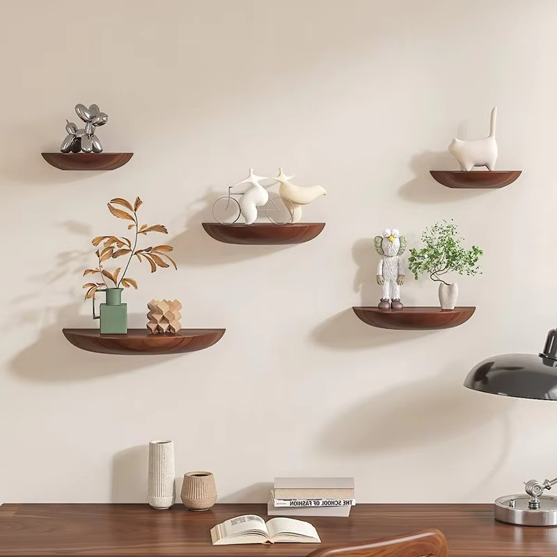 Half-round floating wall shelf with curved front edge and wood-effect finish