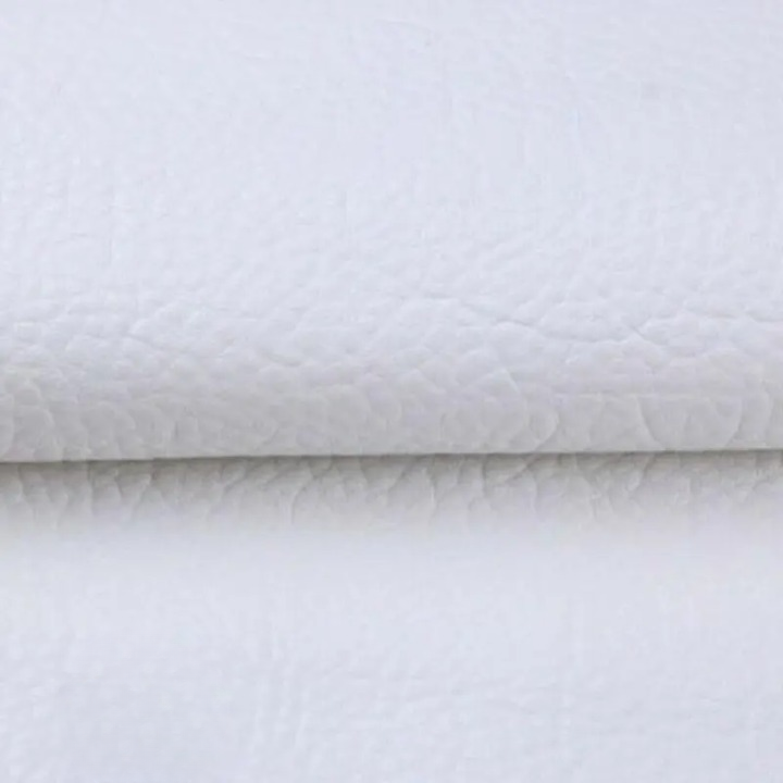 Peel-off repair patch sheet being separated from its white backing