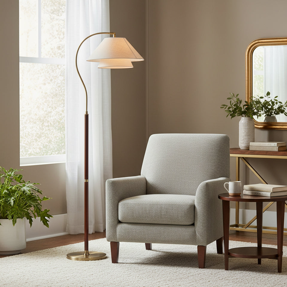 Brown floor lamp with curved arm, beige double shade and gold-tone base