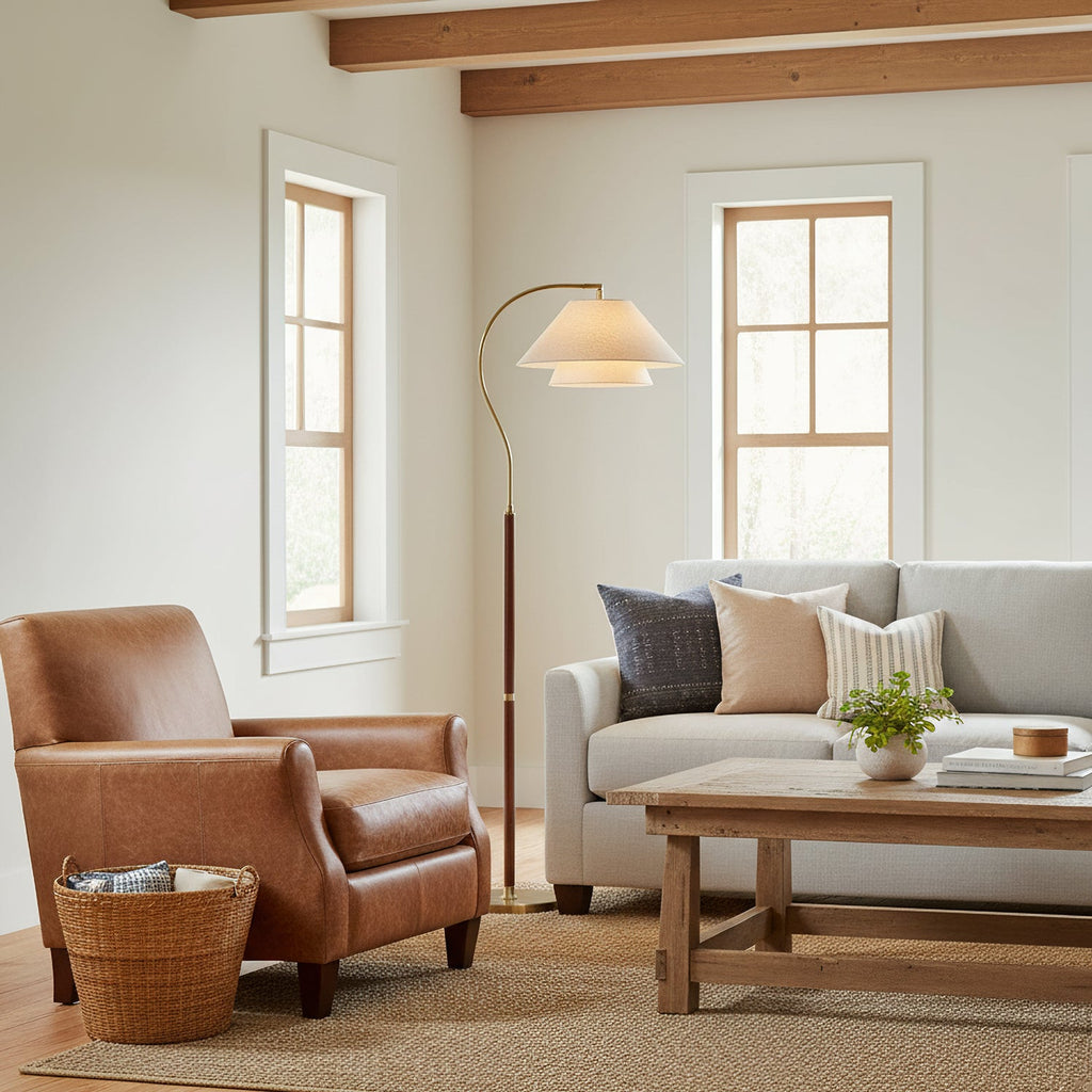 Brown floor lamp with curved arm, beige double shade and gold-tone base