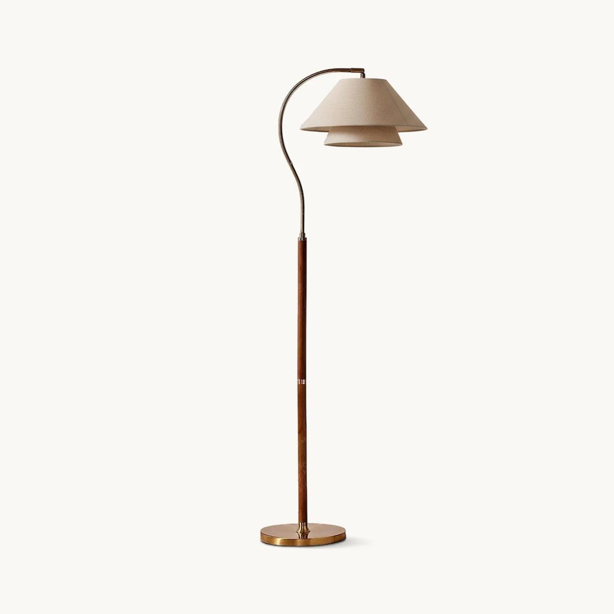 Brown floor lamp with curved arm, beige double shade and gold-tone base