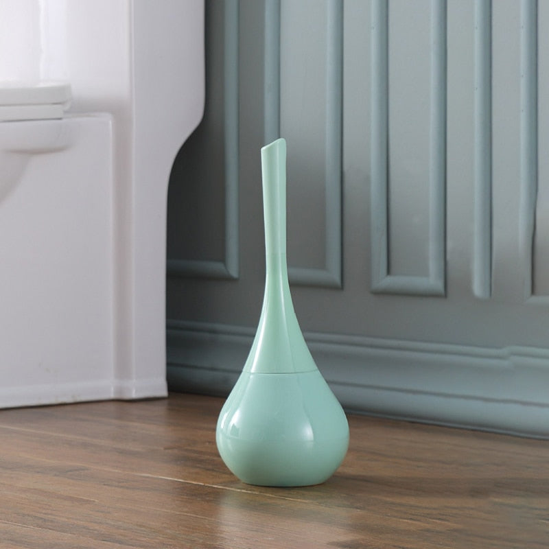 Freestanding toilet brush and rounded holder in metallic finish