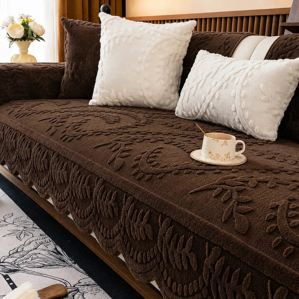 Plush sofa cover with raised botanical leaf texture and scalloped edge
