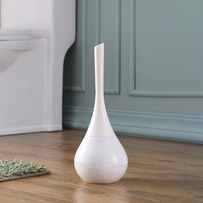 Freestanding toilet brush and rounded holder in metallic finish