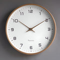 Round analogue wall clock with bold numerals and wood-effect frame