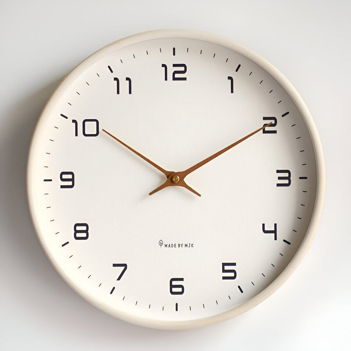 Round analogue wall clock with bold numerals and wood-effect frame