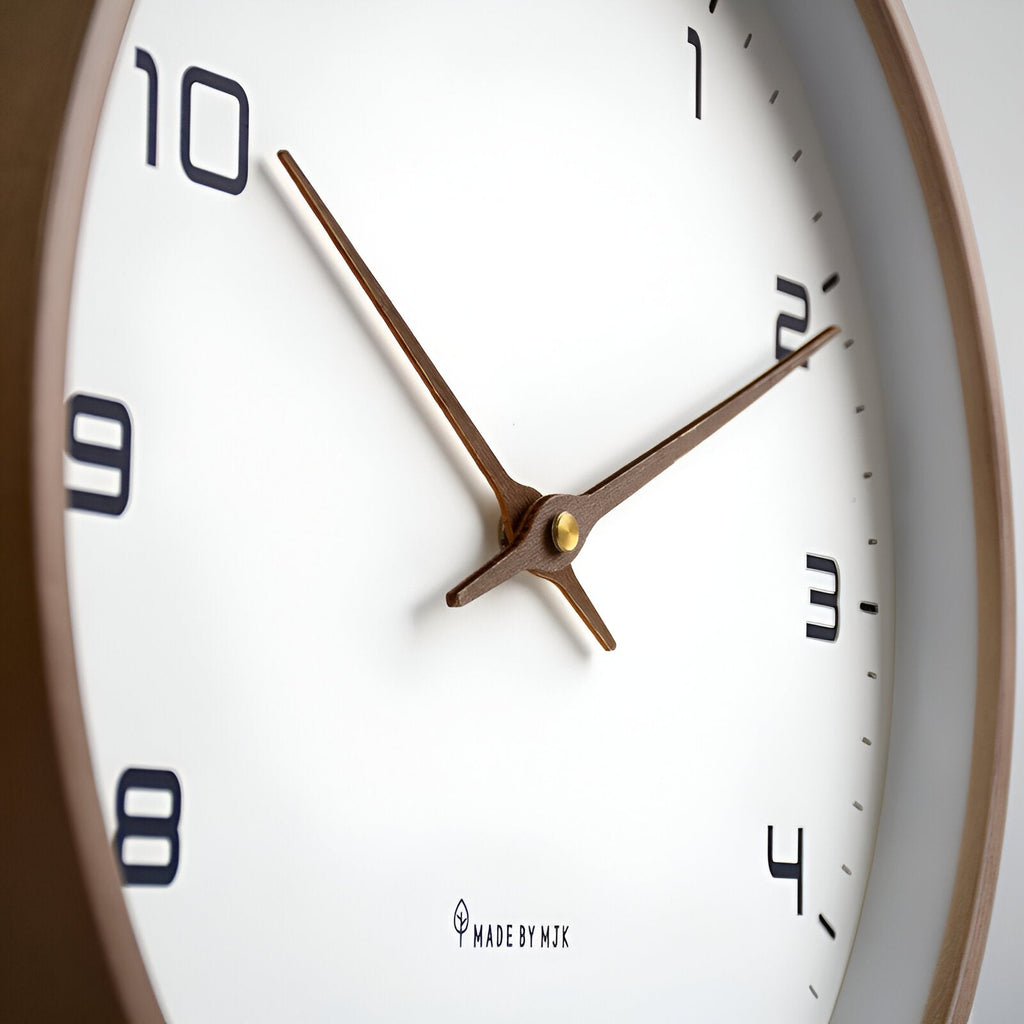 Round analogue wall clock with bold numerals and wood-effect frame