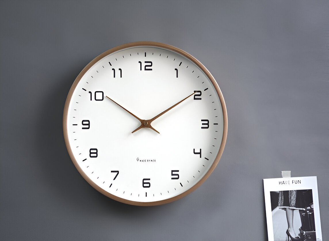 Round analogue wall clock with bold numerals and wood-effect frame