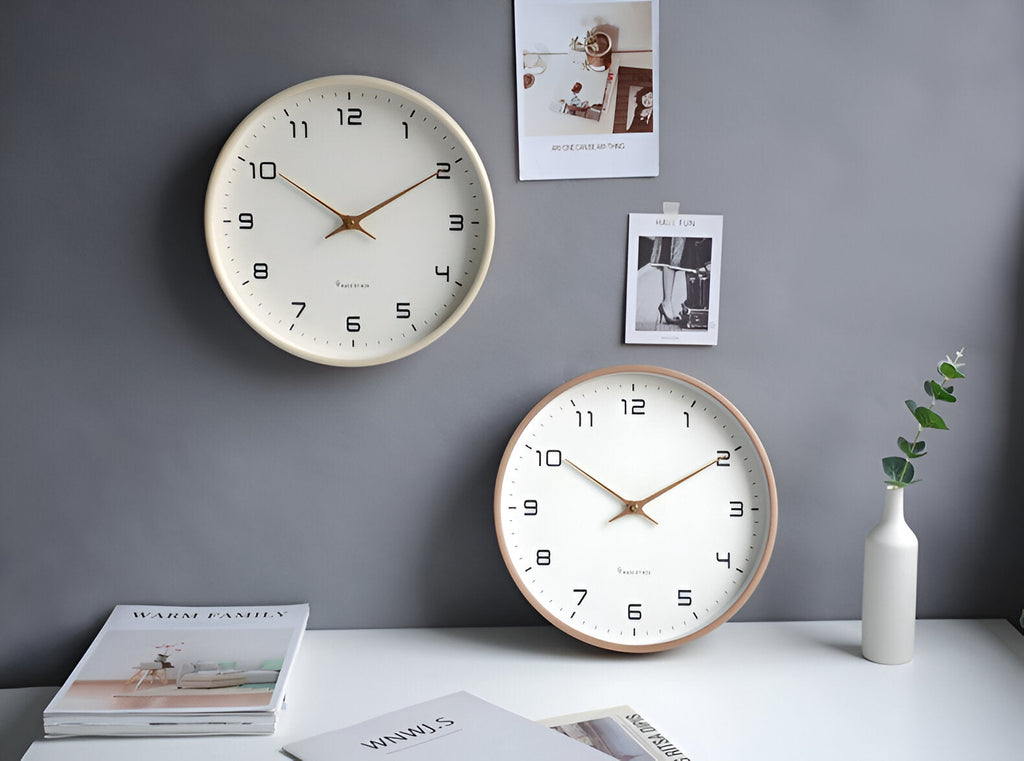 Round analogue wall clock with bold numerals and wood-effect frame