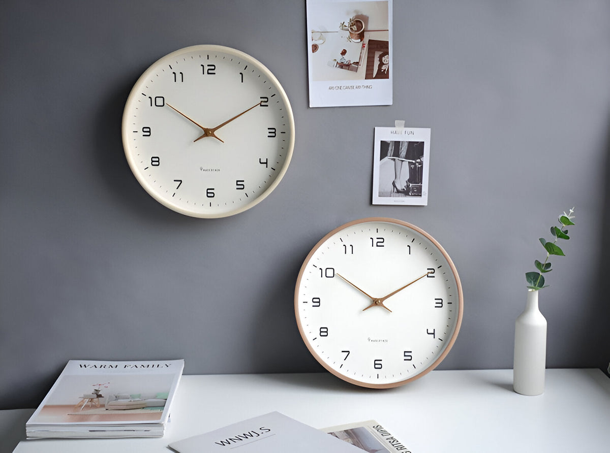 Round analogue wall clock with bold numerals and wood-effect frame