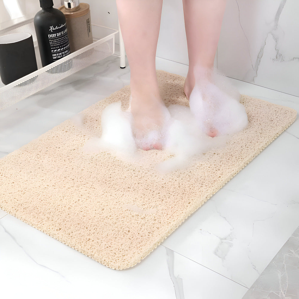 Rectangular textured bathroom mat with rounded corners