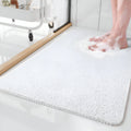 Rectangular textured bathroom mat with rounded corners