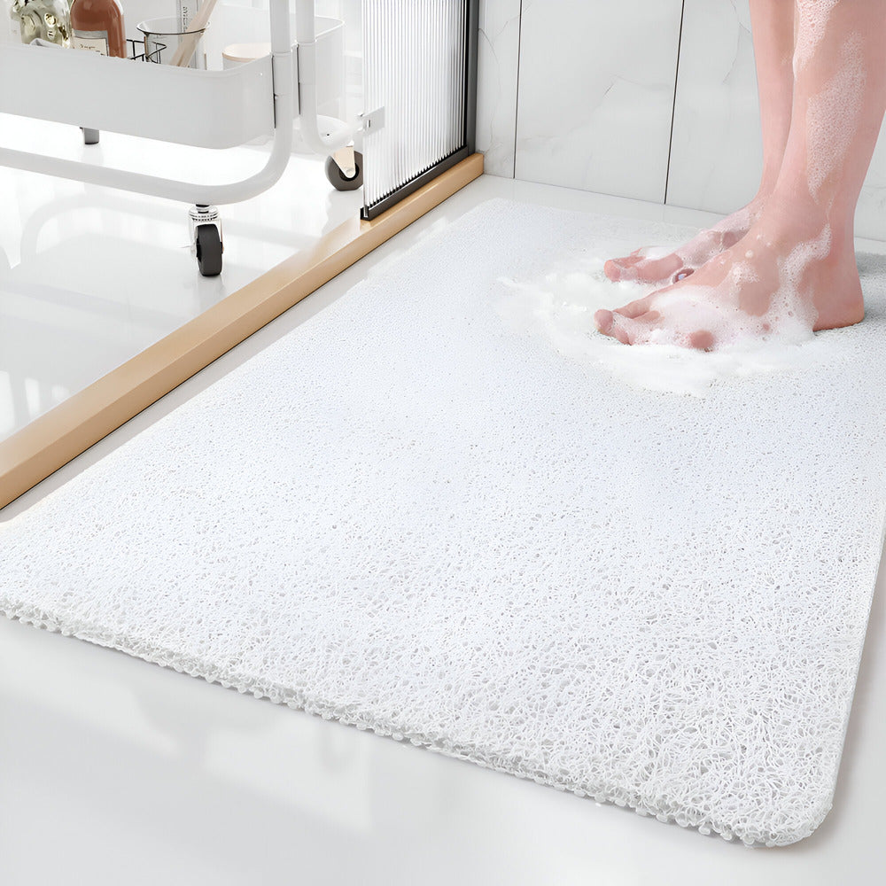 Rectangular textured bathroom mat with rounded corners