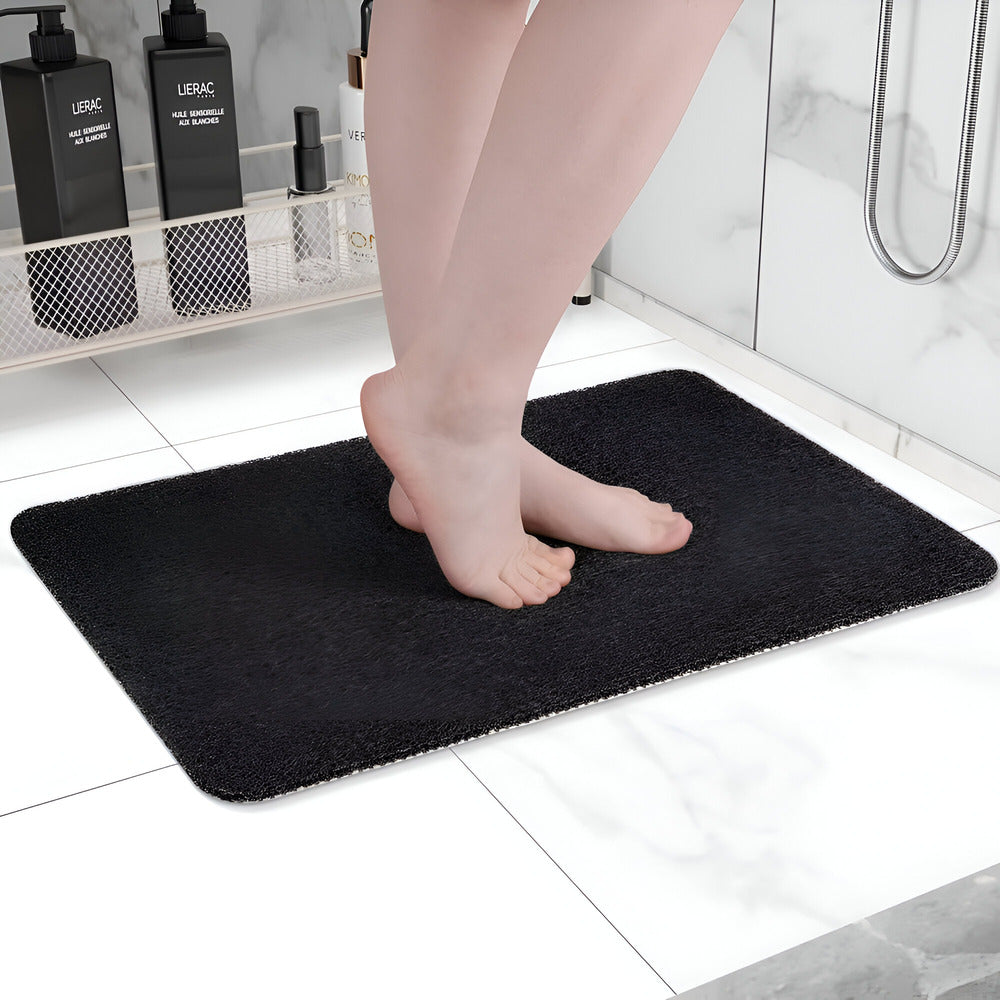 Rectangular textured bathroom mat with rounded corners
