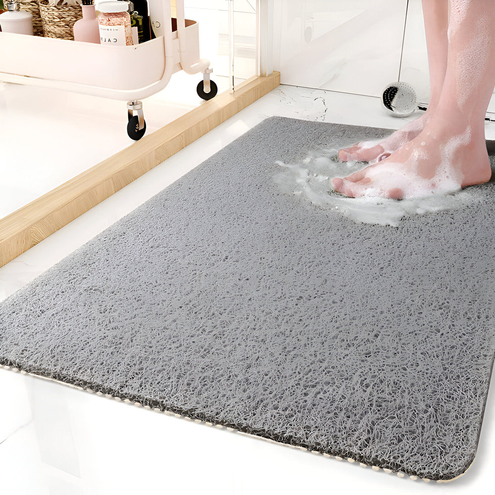 Rectangular textured bathroom mat with rounded corners