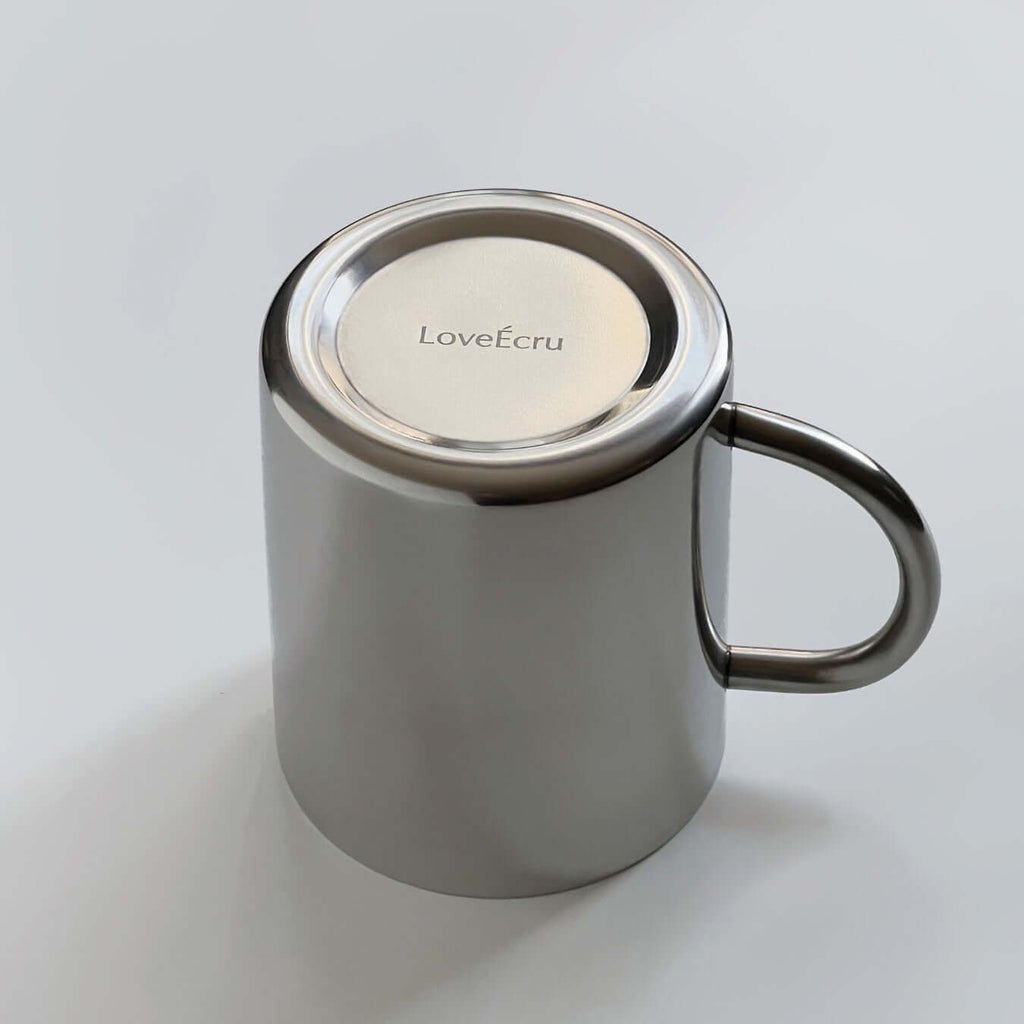 Glossy silver double-layer stainless steel cup with curved handle