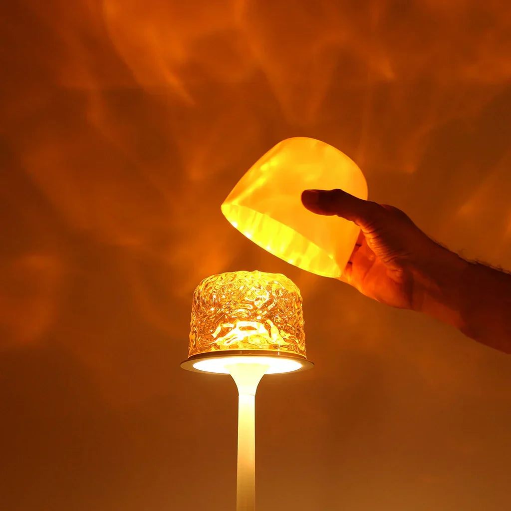 Cream wireless table lamp casting warm aurora-style light patterns
