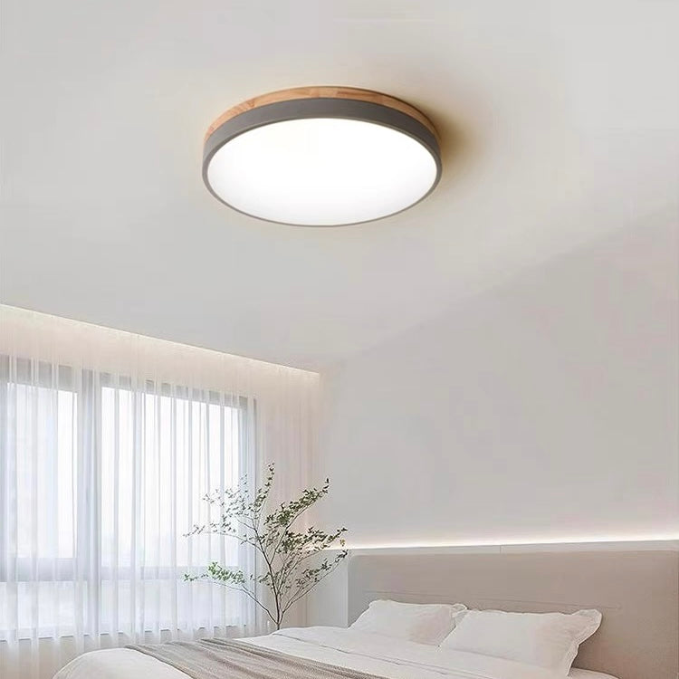 Round flush mount ceiling light with wood-effect rim and white diffuser