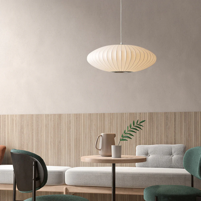 White oval ribbed pendant ceiling light suspended by a white cord