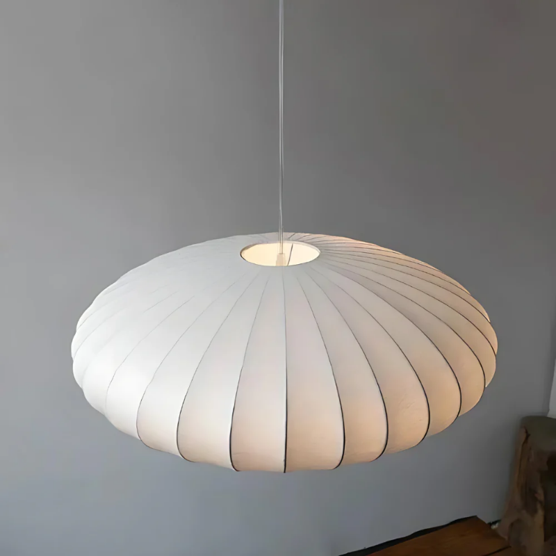 White oval ribbed pendant ceiling light suspended by a white cord